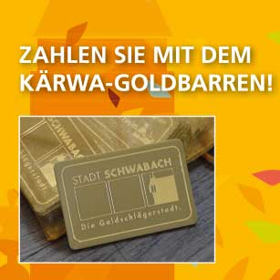 Ein Foto von einer goldfarbenen rechteckigen Plastikkarte auf der das Logo der Stadt Schwabach abgebildet ist. Darüber steht vor einem orange-bunten Hintergrund